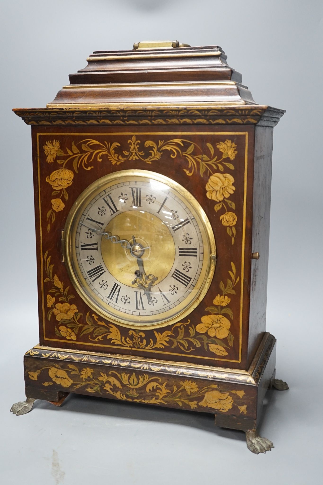 A Victorian floral painted mahogany bracket timepiece, with fusee movement, with key and pendulum, 49cm